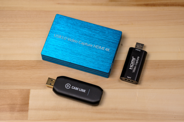Clockwise from bottom: Elgato Cam Link 4K, no-name USB 3.0 capture card, and Y&H HDMI Video Capture Card.